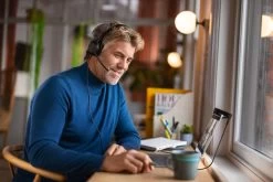 Jabra Evolve2 50 Corded USB Headset -JABRA Store jabra evolve2 50 male working near window on a call medium 2